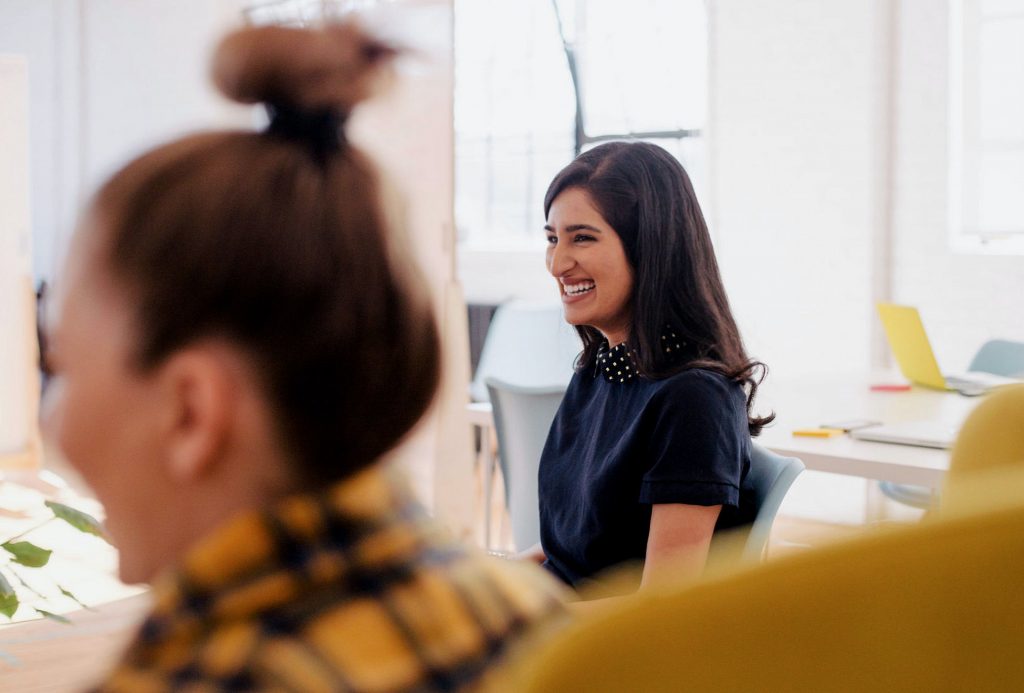 Photo by You X Ventures smiling woman in blue shirt